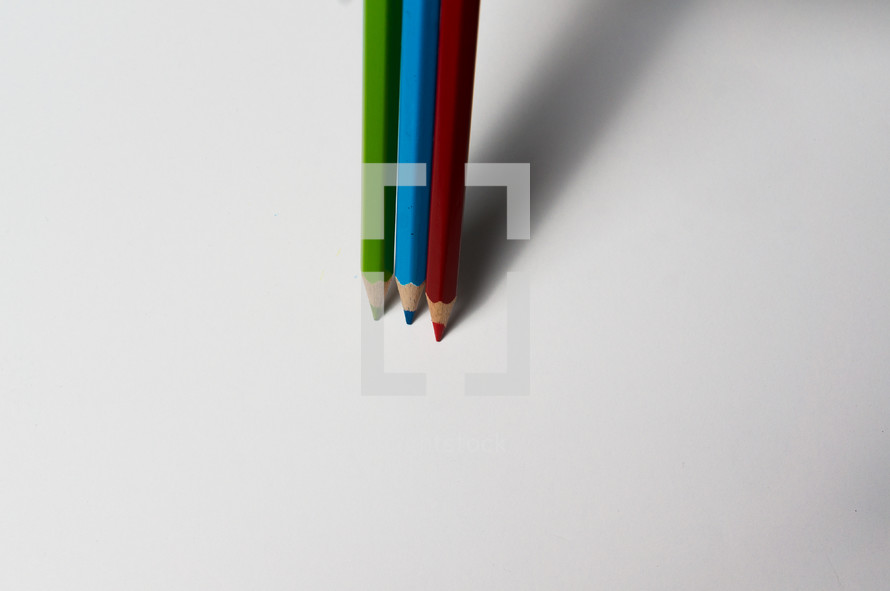 colored pencils on a white background 