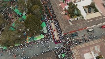 Aerial View Of Devotees And Cucuruchos Carrying Large Float Depicting Christ Carrying The Cross During Holy Week Procession In Antigua, Guatemala.