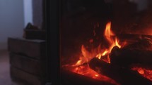 Log burner interior fireplace, warm cosy winter interior fire, wood fire burning, rustic heating