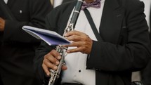 Musician Playing Clarinet At The Holy Week Procession In Antigua, Guatemala. closeup	