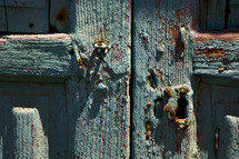 pealing aqua paint on an old wood door 