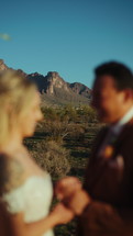 Bride and groom eloping in the desert