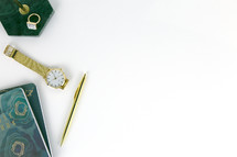 rings, watch, gold, pen, notebook, green, white background