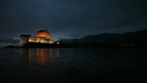 a castle in the rain in Scotland at night 