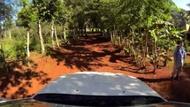 driving on a dirt road in the Dominican Republic
