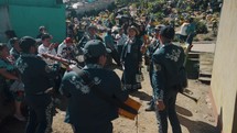 Marching Band Playing Instruments Near The Cemetery During The Sumpango Festival In Guatemala. - POV
