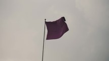 Purple Flag Swaying With The Wind During Holy Week In Antigua Guatemala - low angle	