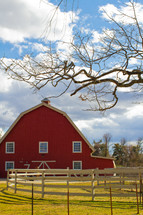 a red barn and fence 
