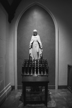 statue of Mary and prayer candles 