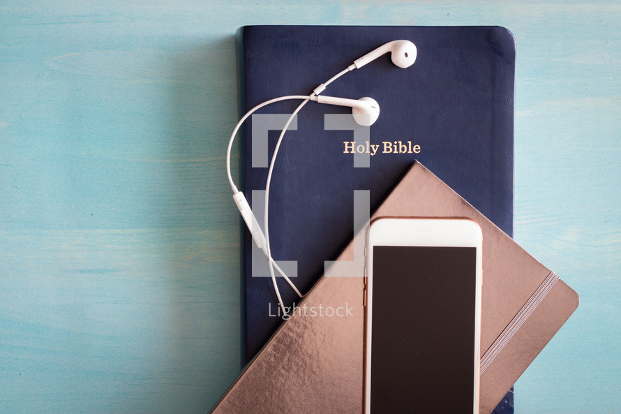 Bible, journal, cellphone, earbuds 