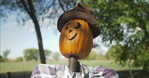 Spooky Halloween, pumpkin scarecrow decoration at pumpkin patch in autumn, fall season.