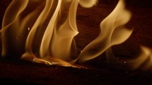 Fire wood, nice piece of wood burning in close-up and slow motion