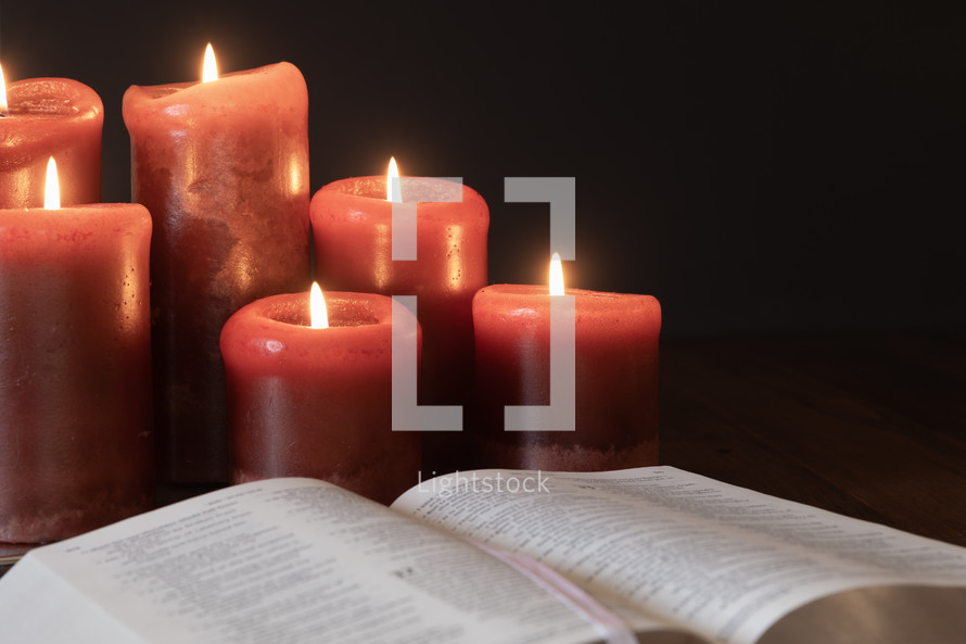 candles and open Bible 