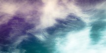 feathery clouds dreamy purple and turquoise background 