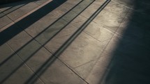 Sun beam on concrete tile floor