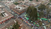 Catholic People Marching With Andas Processional Float During Semana Santa In Antigua, Guatemala. Aerial Drone Shot