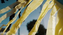 Yellow Paper Tassel Garlands Of Giant Kite Blowing With The Wind In Sumpango, Guatemala. - close up	