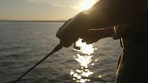 fisherman casting a fishing pole 