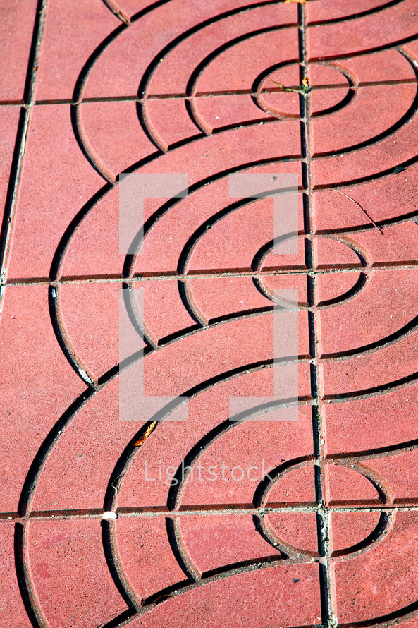 abstract cross in a brick patio 
