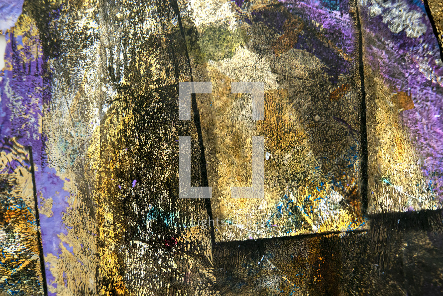 abstract painted surface resembling boards, in gold, tan, black, purple