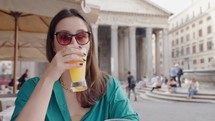 Young Tourist having a drink in front Pantheon in Rome, Italy. Tourist exploring Rome