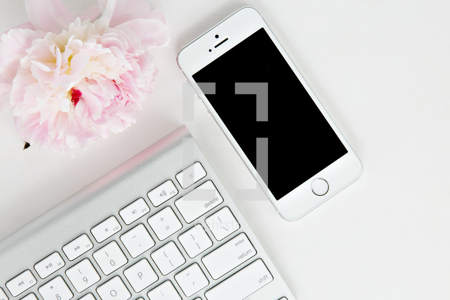 phone, flowers, and computer keyboard 