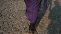 Feet Of A Cucurucho In Purple Dress Walking On The Street Of Antigua During Semana Santa. slowmo	