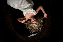 bride lying on carpet