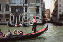 tourists on a gondola in Venice, Italy 