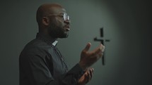 African American Priest Preaching a Sermon in Church
