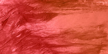 bold red textural background of smeared paint surface