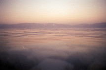 Water in The Dead Sea with mountains on the horizon