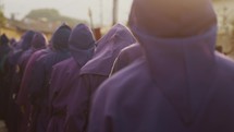 Easter Sunday Of Holy Week Celebration With Men In Purple Hooded Robes In Antigua, Guatemala. Slow Motion	
