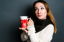 teen girl holding a mug of hot cocoa 