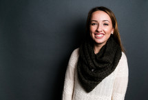portrait of a smiling teen girl in a scarf 