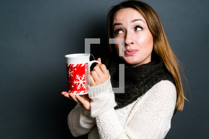 teen girl holding a mug of hot cocoa 