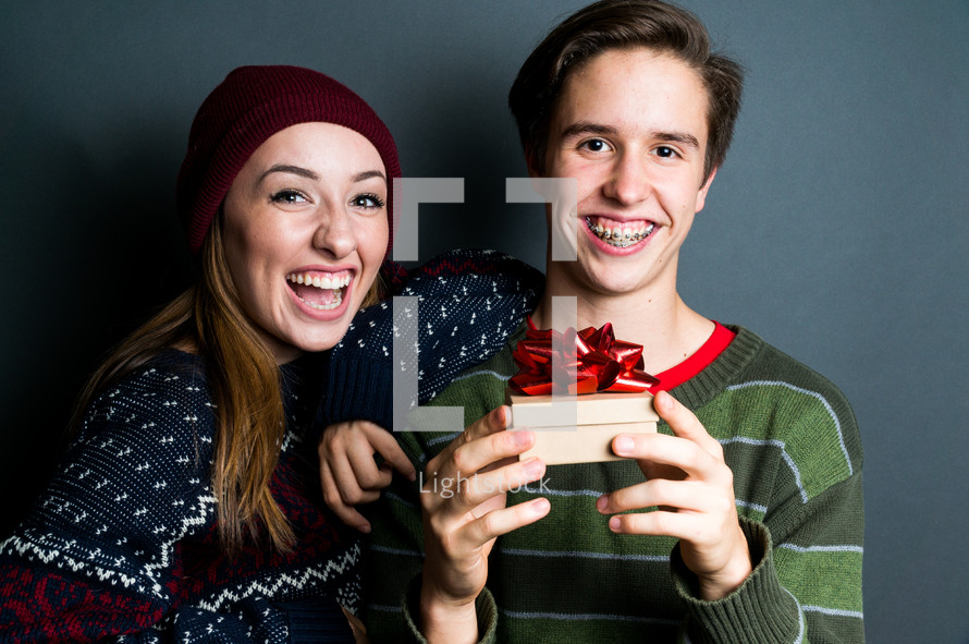 teens with a Christmas gift 