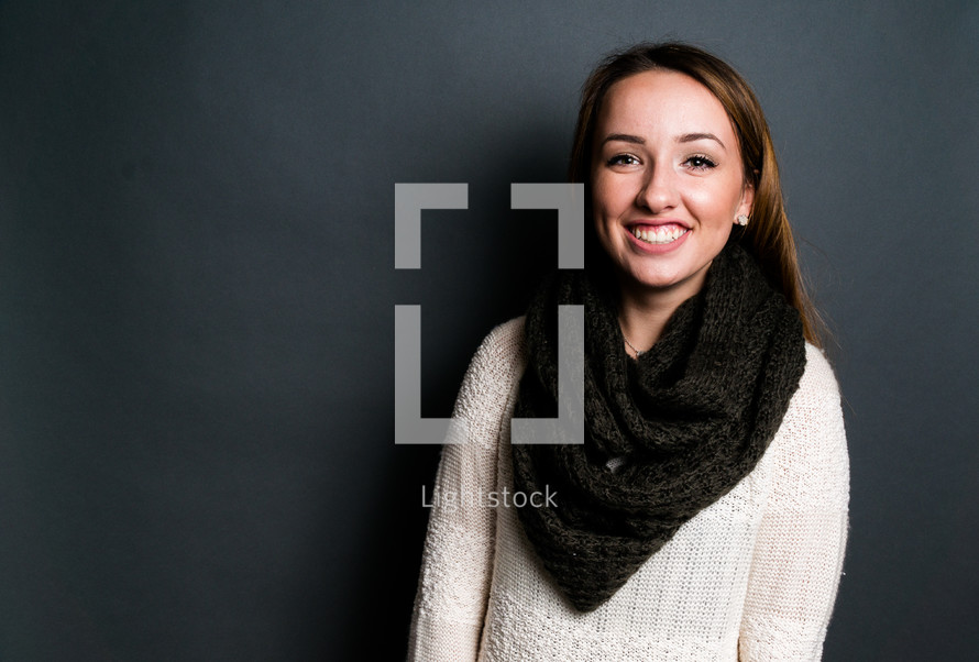 portrait of a smiling teen girl in a scarf 
