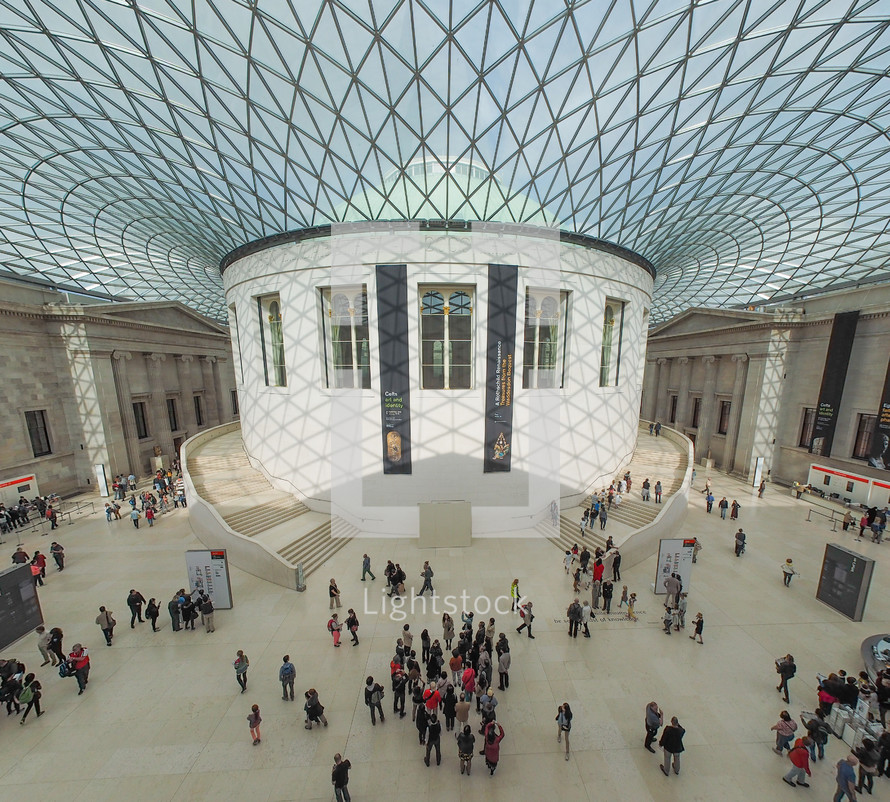 LONDON, UK - SEPTEMBER 28, 2015: Tourists in the Great Court at the British Museum designed by architect Lord Norman Foster opened in year 2000 seen with fisheye lens