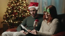 Couple boy and girl write letter to santa clause for Christmas