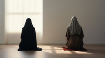 Two nuns praying