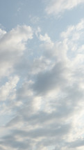 soft, side-lit clouds in vertical format