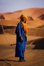 man leading camels 