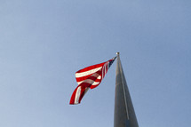 looking up at an American flag 
