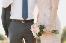 torsos of a bride and groom 