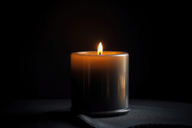 Candle with Flame on Dark Background
