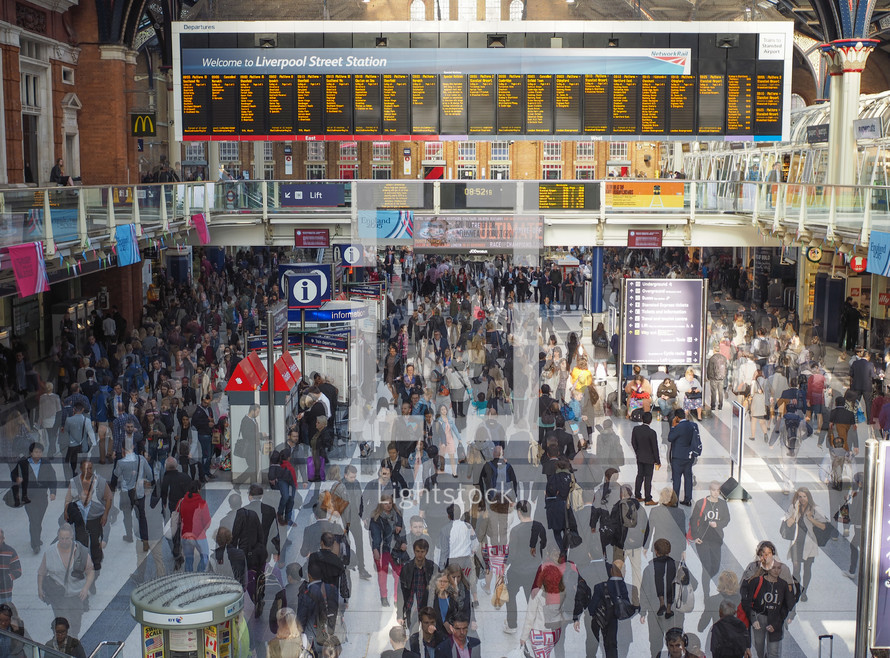 LONDON, UK - SEPTEMBER 28, 2015: Travellers at Liverpool Street Station multi exposure time lapse