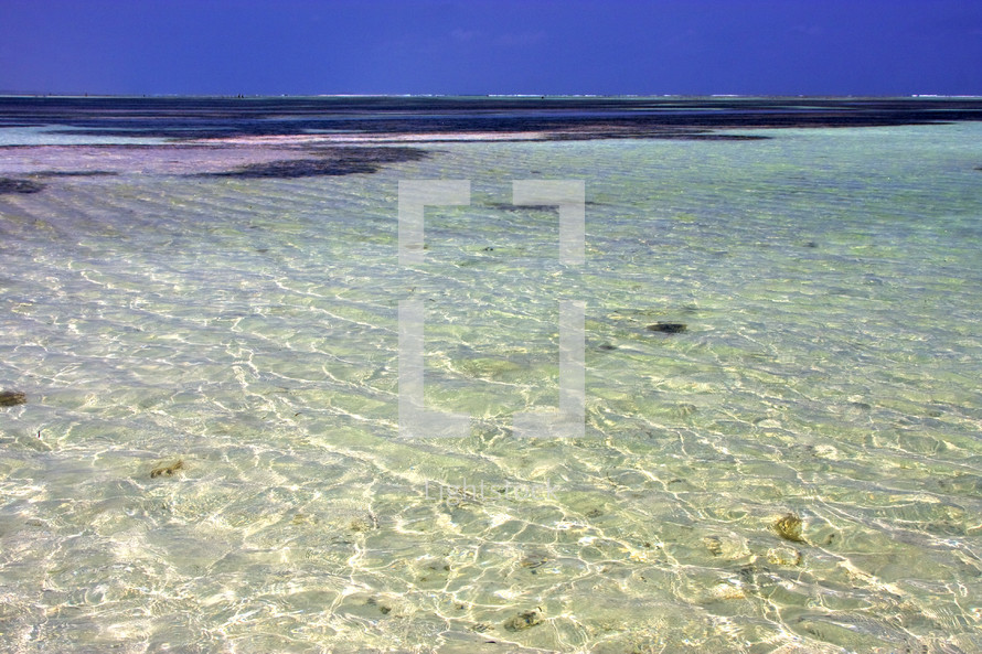crystal clear sea water along the African coastline of Zanzibar 