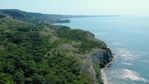 Aerial View Of Coastal Cliff With Lush Vegetation In Heros Beach, Balchik, Bulgaria - drone shot