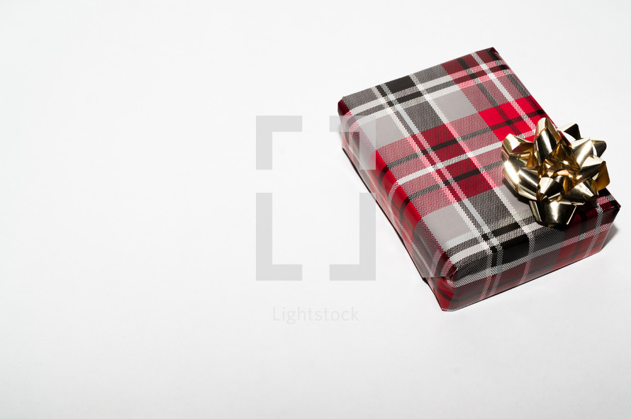 a wrapped Christmas gift on a white background 